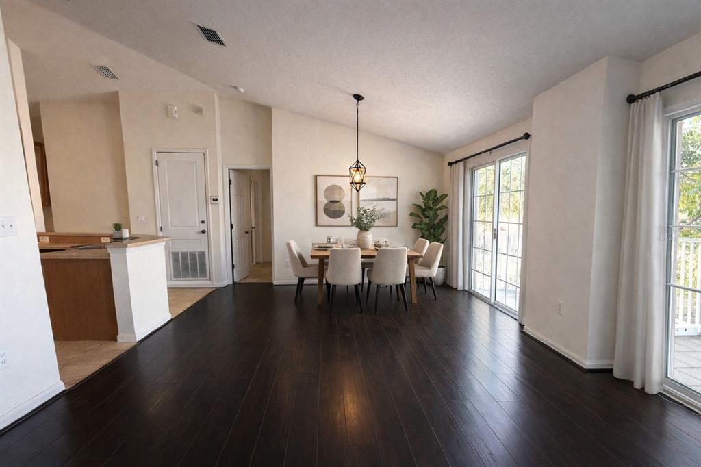 5318 Anhinga Trail New Port Richey, FL 34653 - Photo 6 of 17 a view of a dining room with furniture window and wooden floor