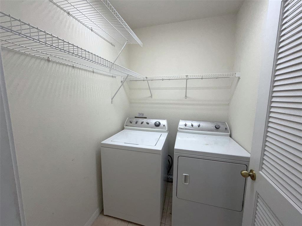 5318 Anhinga Trail New Port Richey, FL 34653 - Photo 9 of 17 a utility room with dryer and washer