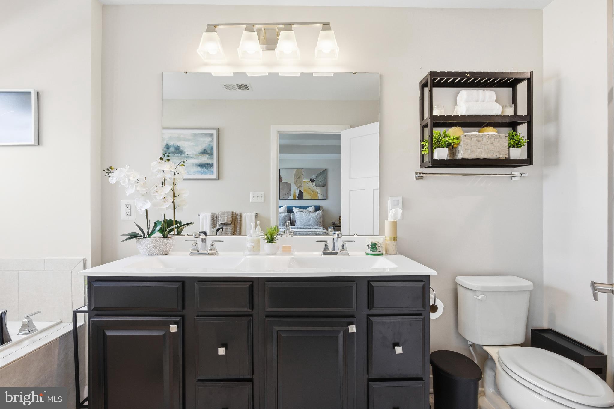 103 Freedom Way Sicklerville, NJ 08081 - Photo 20 of 43 a bathroom with a sink vanity and a mirror