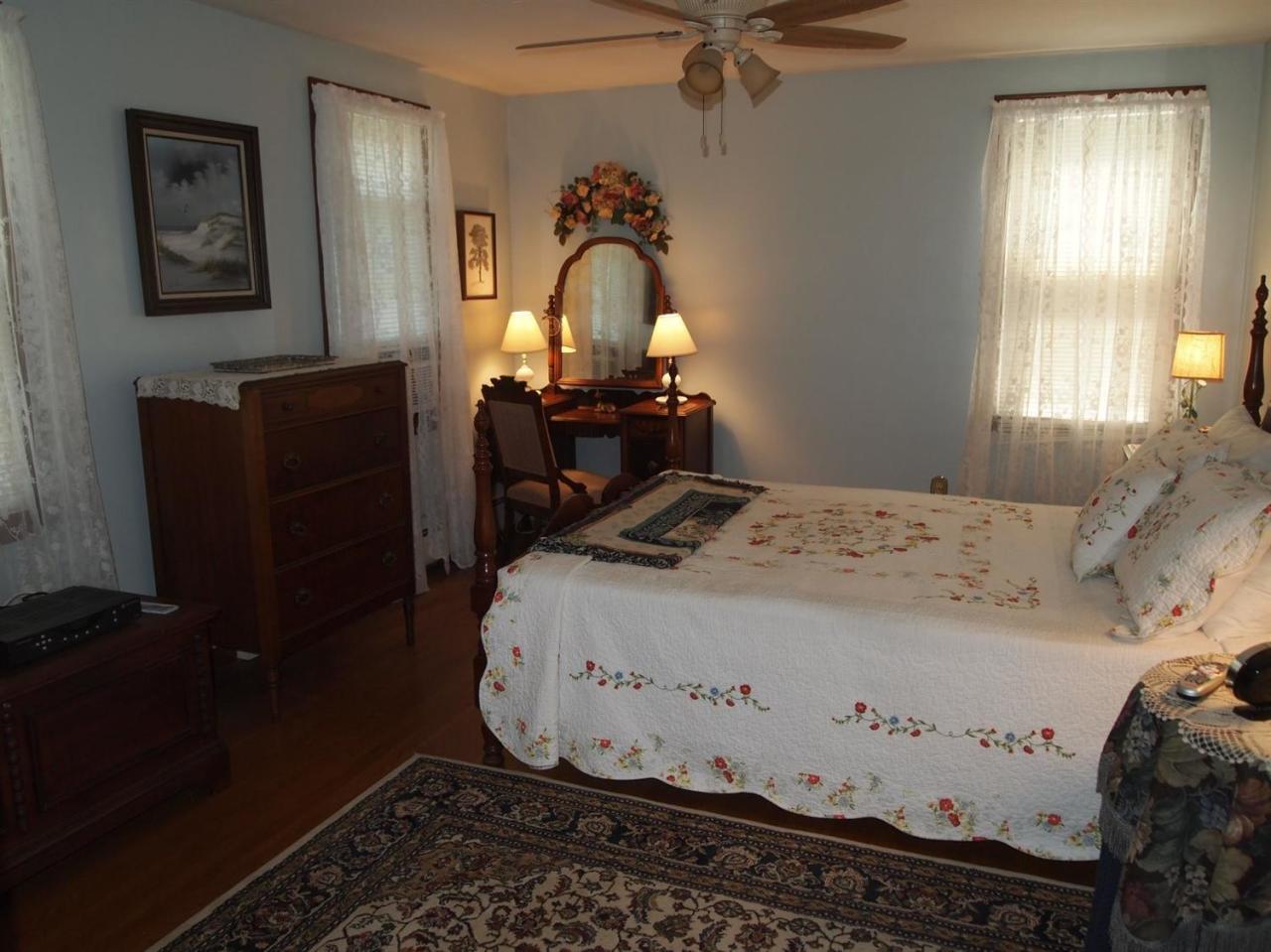 161 Capn Crosby Road Centerville, MA 02632 - Photo 11 of 23 a bedroom with a bed and wooden floor