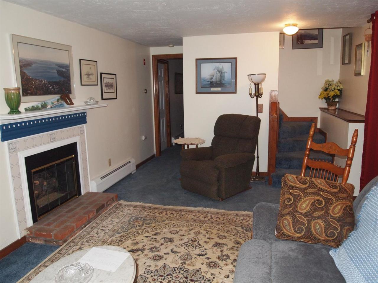 161 Capn Crosby Road Centerville, MA 02632 - Photo 16 of 23 a living room with furniture and a fireplace