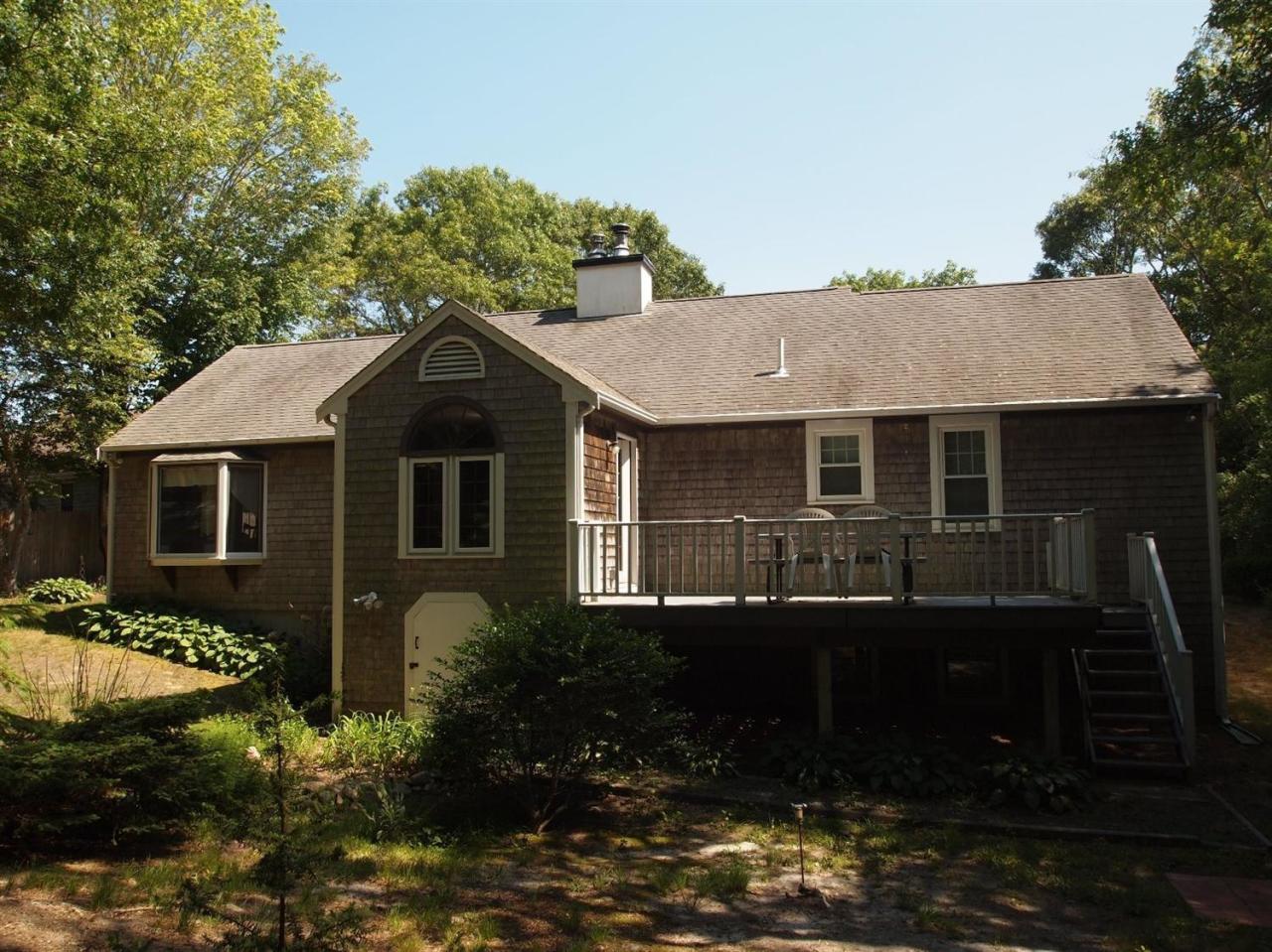 161 Capn Crosby Road Centerville, MA 02632 - Photo 20 of 23 a front view of a house with garden