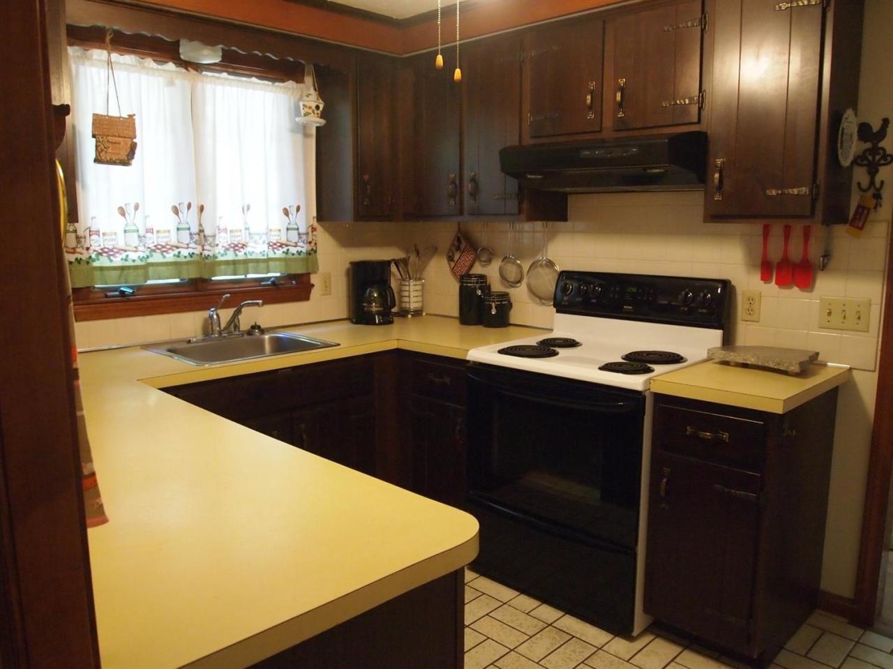 161 Capn Crosby Road Centerville, MA 02632 - Photo 7 of 23 a kitchen with a sink a stove and a microwave