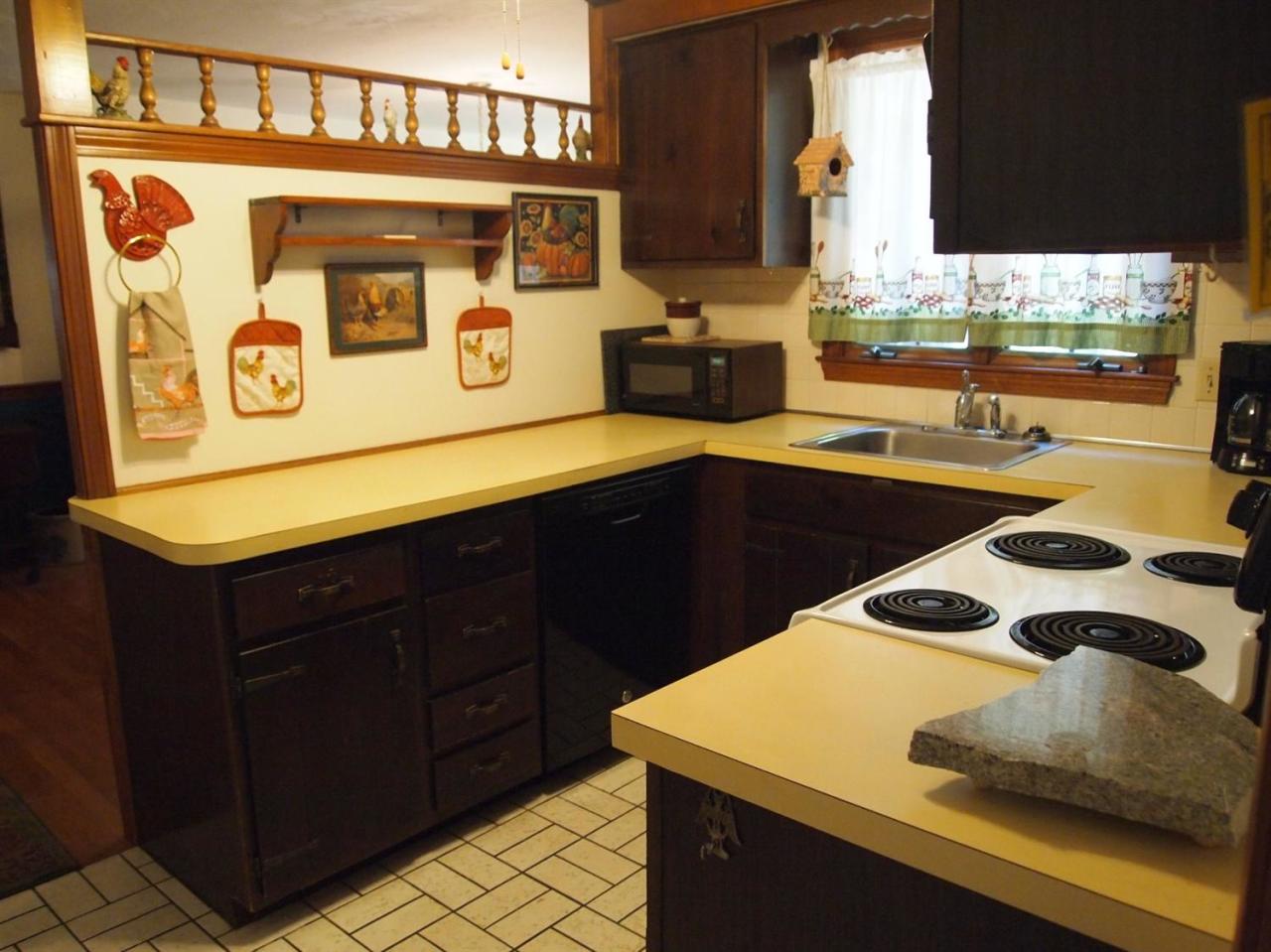 161 Capn Crosby Road Centerville, MA 02632 - Photo 8 of 23 a kitchen with a sink and cabinets