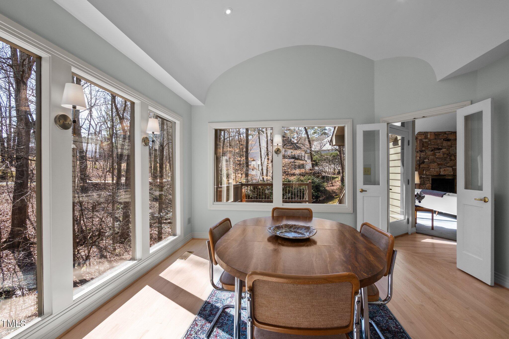 8804 Ross Court Raleigh, NC 27613 - Photo 14 of 38 a view of a dining room with furniture window and wooden floor