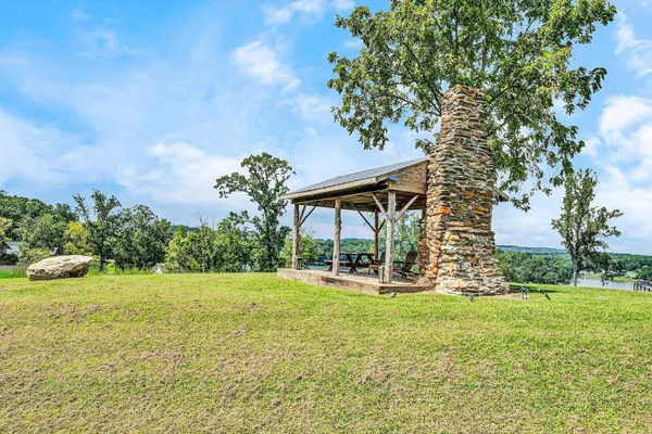 a view of a park with iron fence