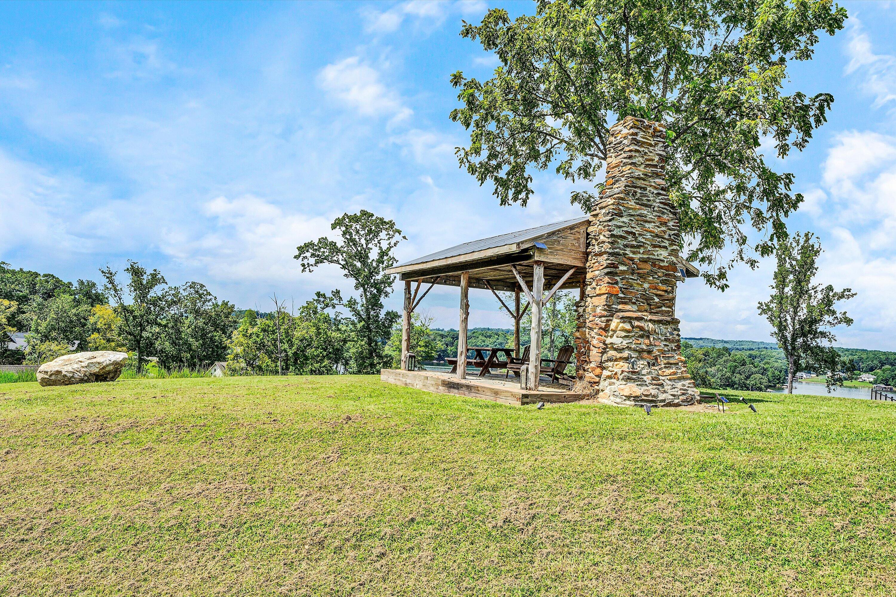Lot 22 Cliffs Drive Union Hall, VA 24176 - Photo 12 of 19 a backyard of a house with yard and outdoor seating