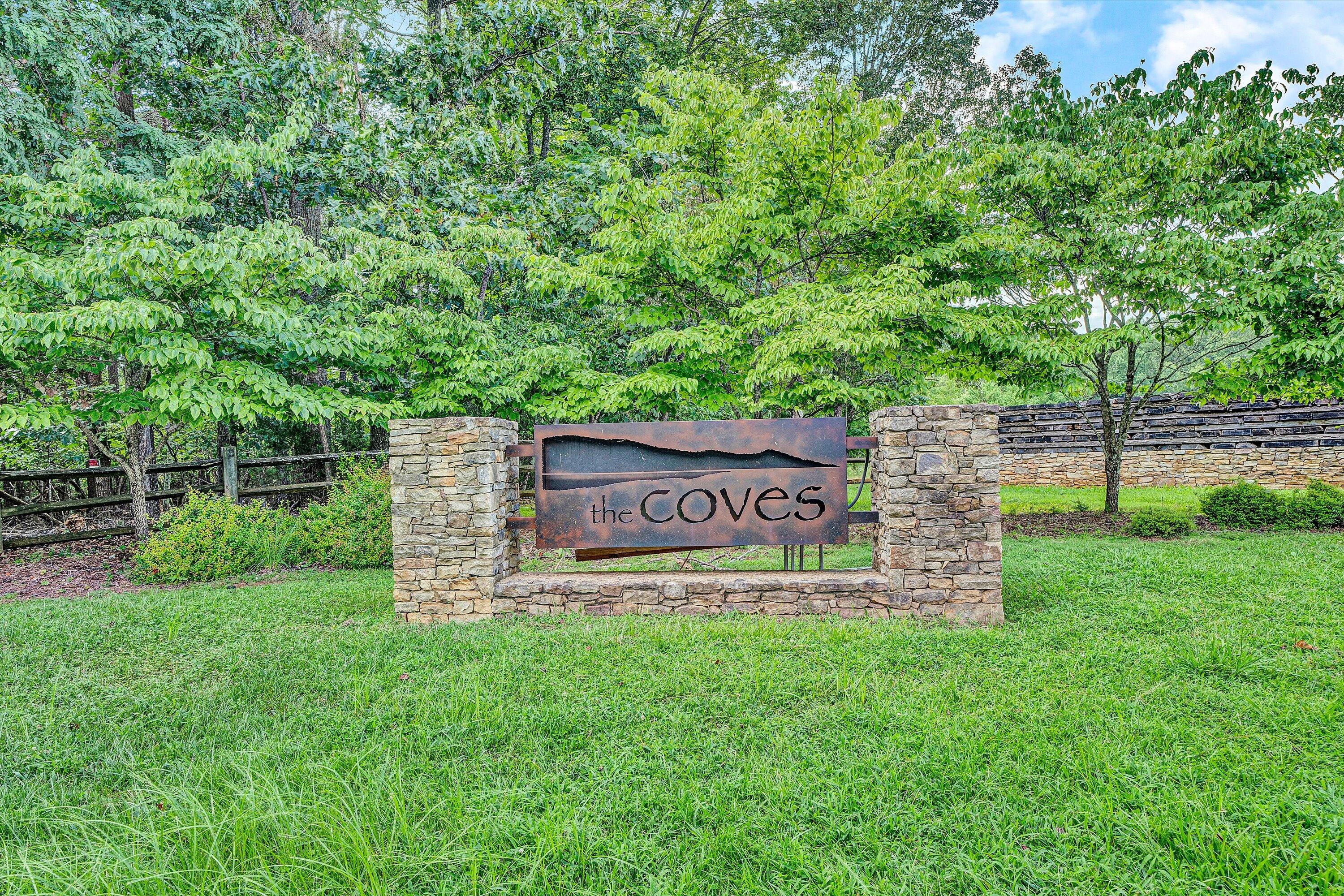 Lot 22 Cliffs Drive Union Hall, VA 24176 - Photo 10 of 19 a sign that is sitting in the grass near a tree