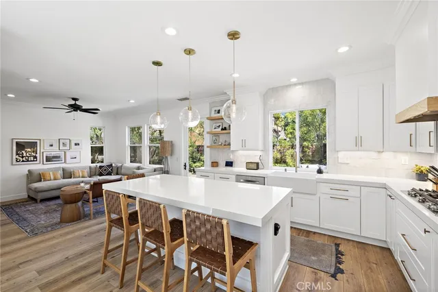 a large kitchen with a table and chairs