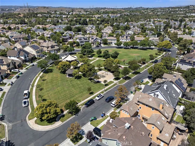 an aerial view of a residential houses with outdoor space