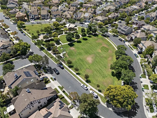 an aerial view of a residential houses with outdoor space