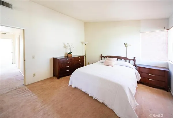 a bedroom with a bed and a cabinets
