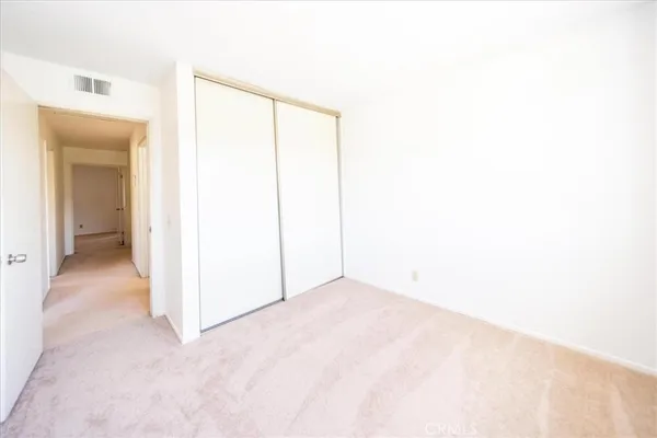 a view of a room with a hallway