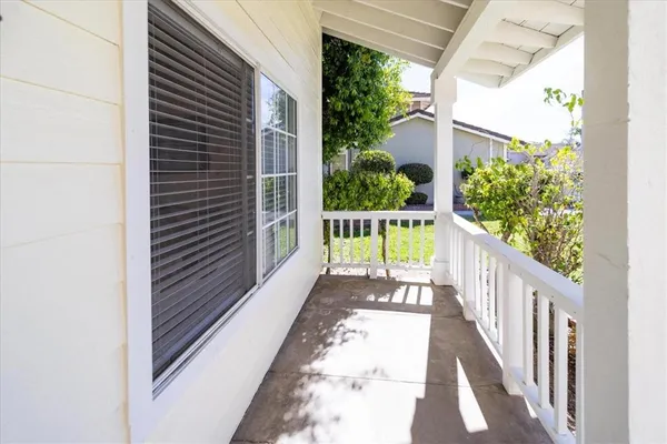 a view of balcony with wooden floor