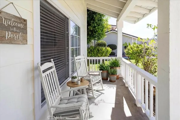 a view of a chair and table in backyard