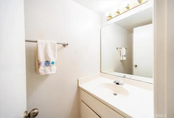 a bathroom with a sink and mirror