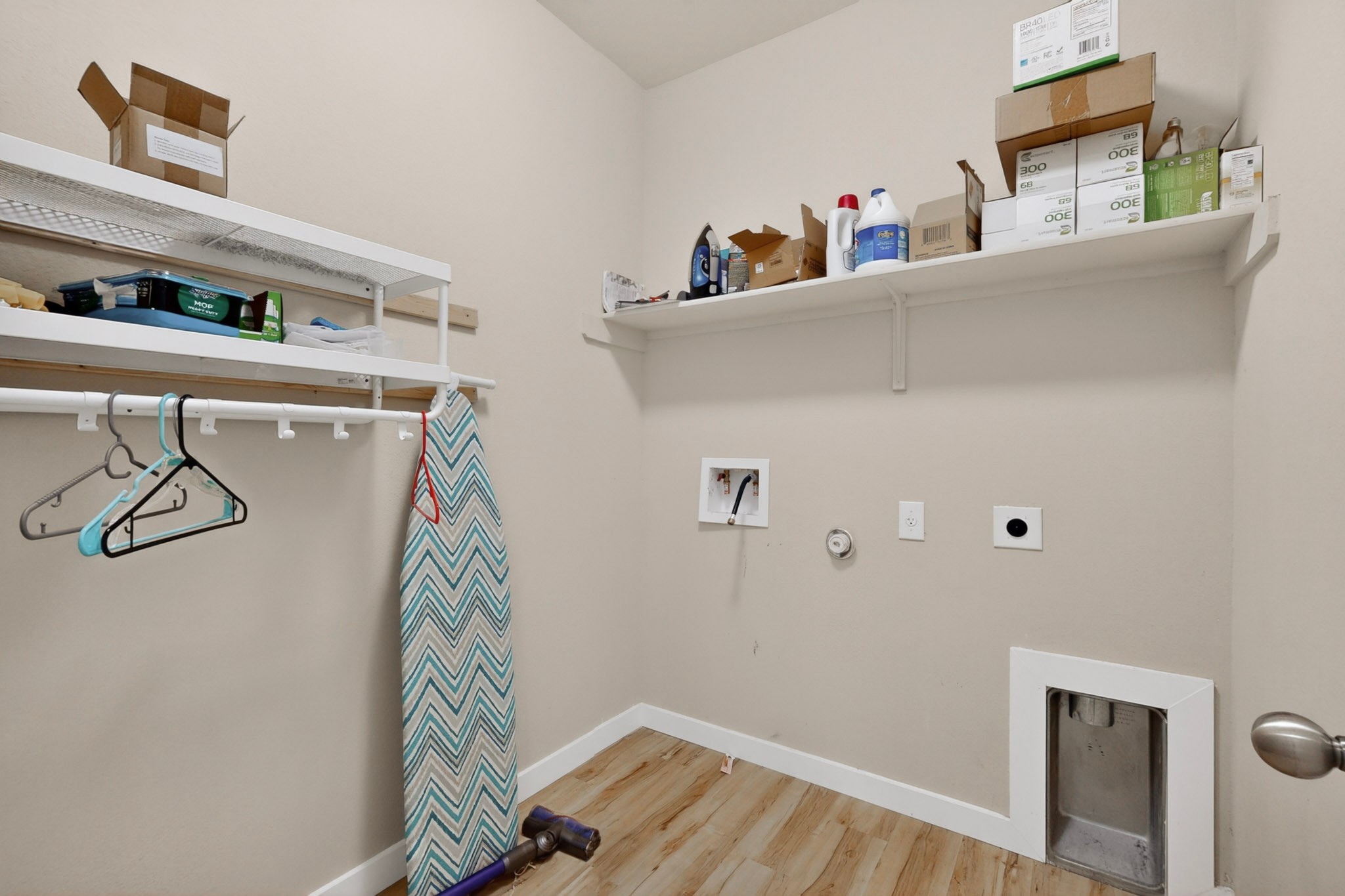 14513 Esker Road Manor, TX 78653 - Photo 29 of 38 A well-organized laundry area offers practical shelving and a convenient utility sink.