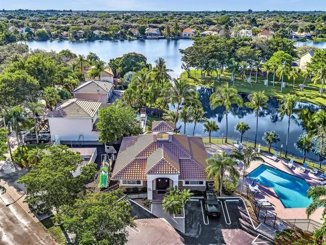 a front view of a house with a yard table and chairs