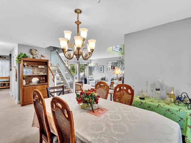 a swimming pool with outdoor seating and yard