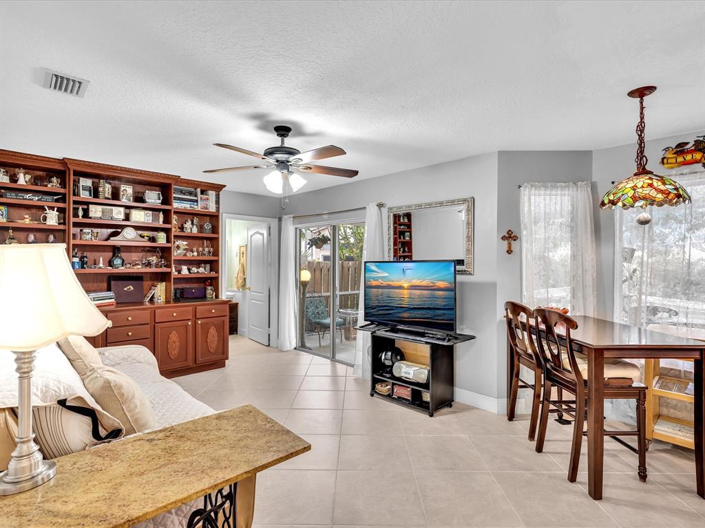 11240 Reveille Road Cooper City, FL 33026 - Photo 21 of 97 a living room with furniture and wooden floor