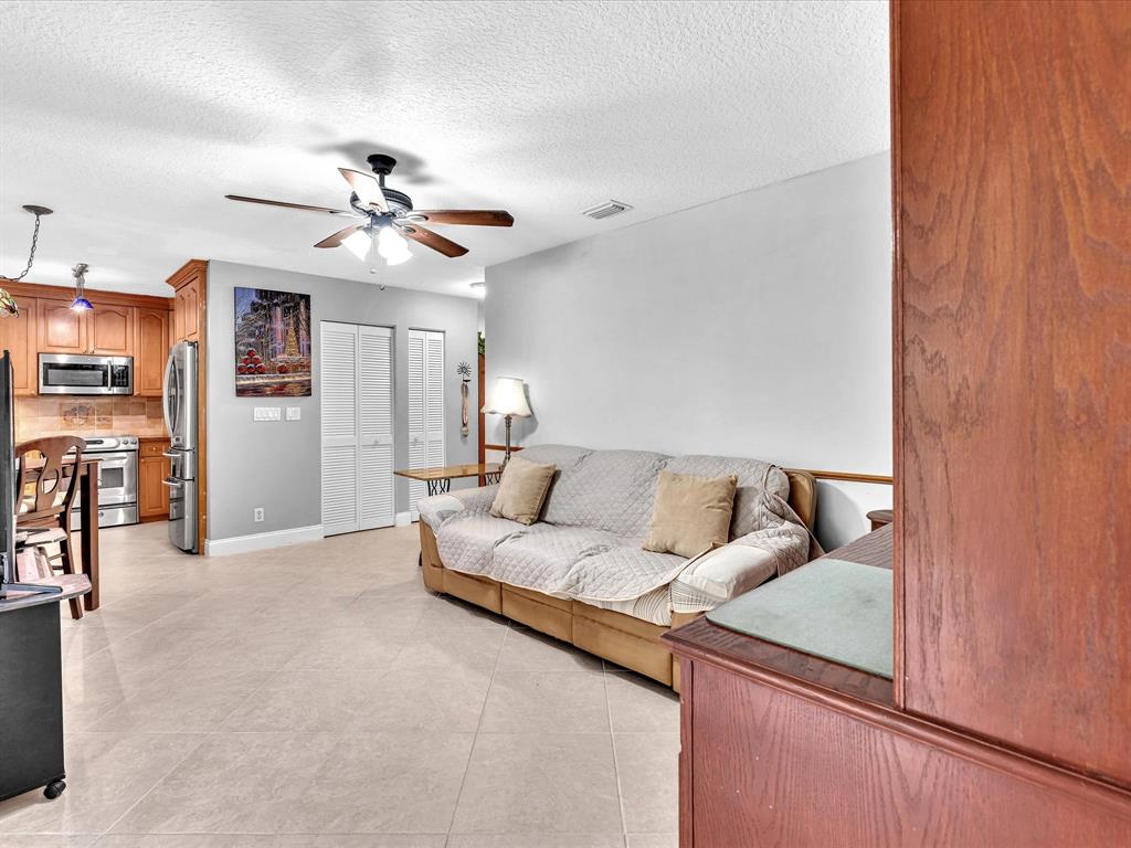 11240 Reveille Road Cooper City, FL 33026 - Photo 25 of 97 Looking at family room from screened patio