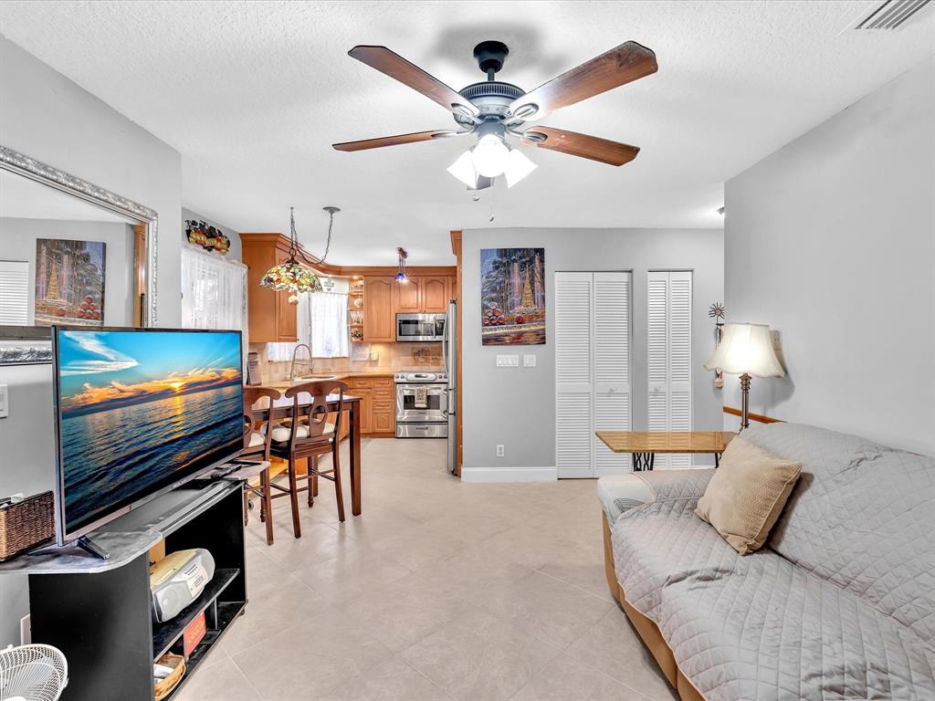 11240 Reveille Road Cooper City, FL 33026 - Photo 26 of 97 Looking at family room, breakfast area and kitchen from downstairs cabana bath.