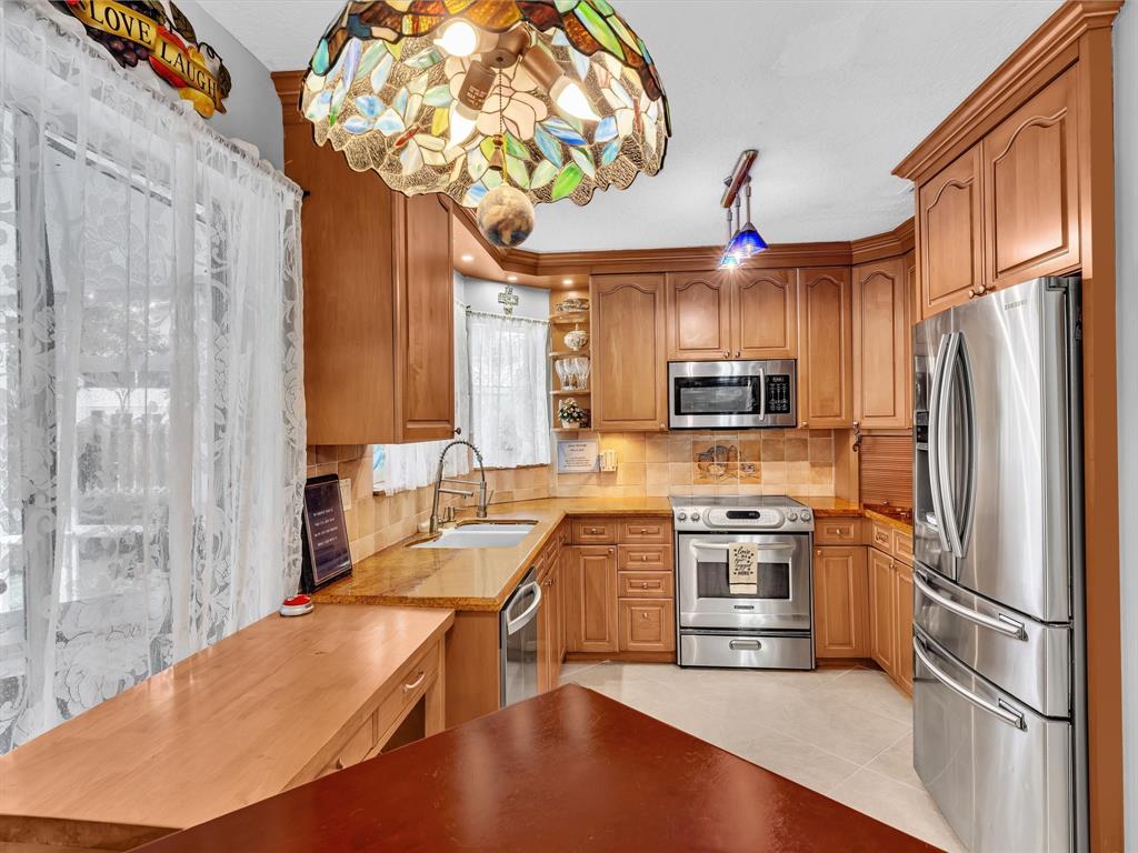 11240 Reveille Road Cooper City, FL 33026 - Photo 28 of 97 This is a custom built kitchen with every inch used for storage. 2nd side counter is not shown.