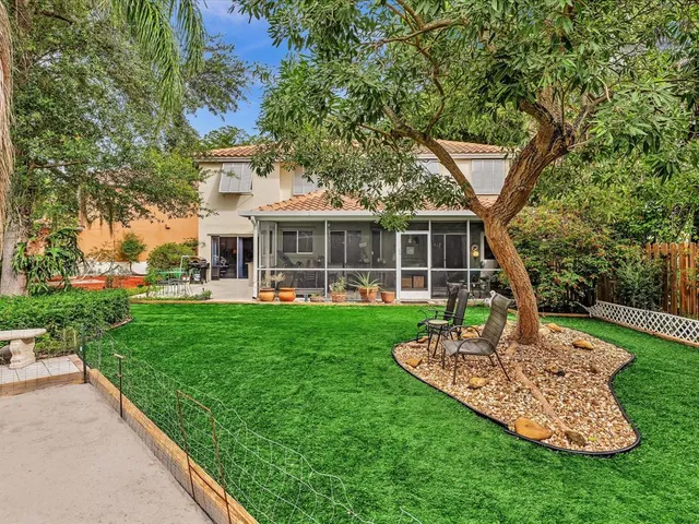 a living room with furniture and stairs