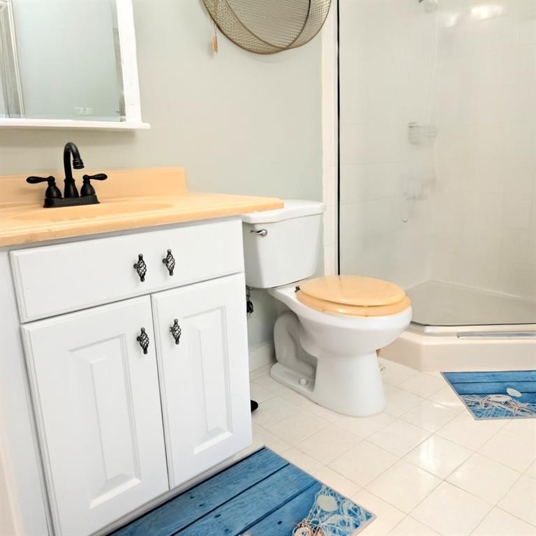 11240 Reveille Road Cooper City, FL 33026 - Photo 40 of 97 a bathroom with a sink a toilet and a mirror
