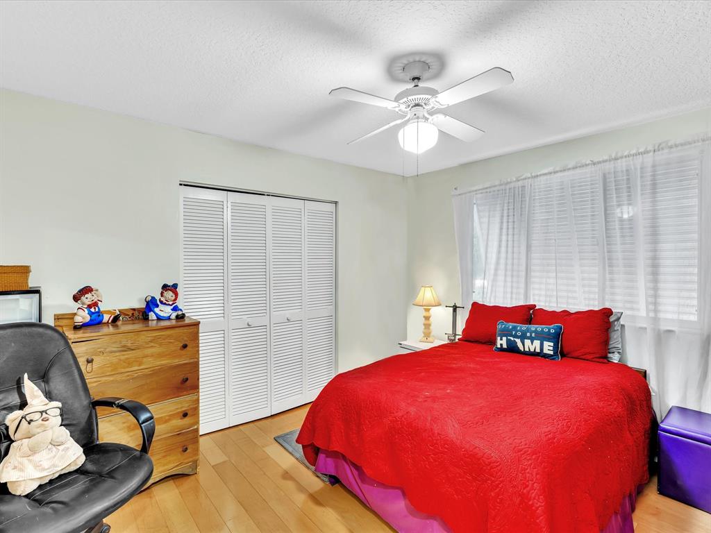 11240 Reveille Road Cooper City, FL 33026 - Photo 43 of 97 a bedroom with a bed and dresser