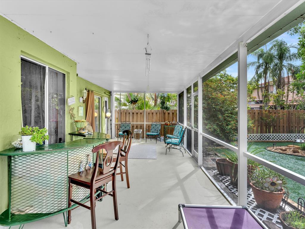 11240 Reveille Road Cooper City, FL 33026 - Photo 57 of 97 a view of a patio with chairs and backyard