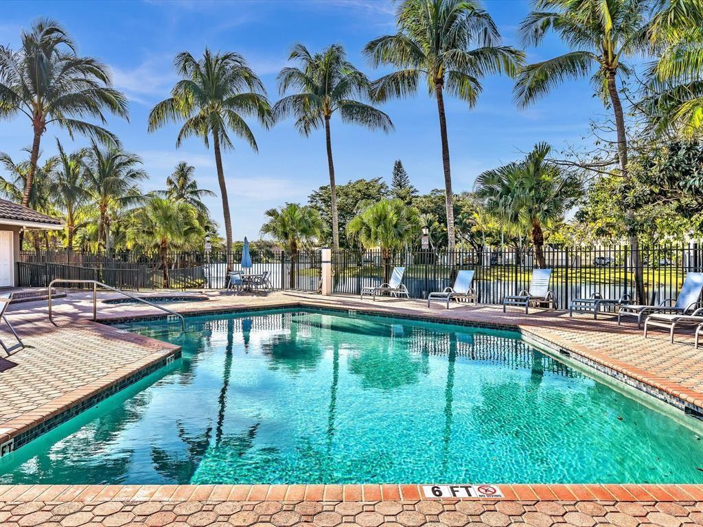 11240 Reveille Road Cooper City, FL 33026 - Photo 79 of 97 a swimming pool with outdoor seating and yard