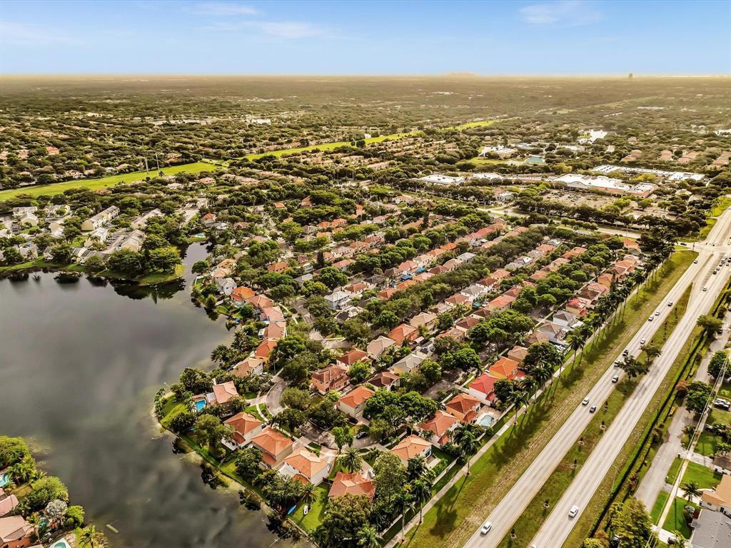 11240 Reveille Road Cooper City, FL 33026 - Photo 92 of 97 an aerial view of residential building and lake