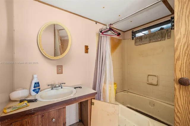 a bathroom with a sink double vanity and a mirror