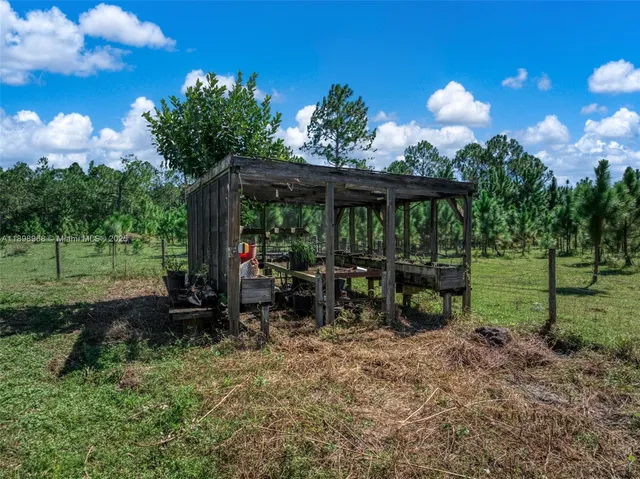 a view of a chair and tables in the patio