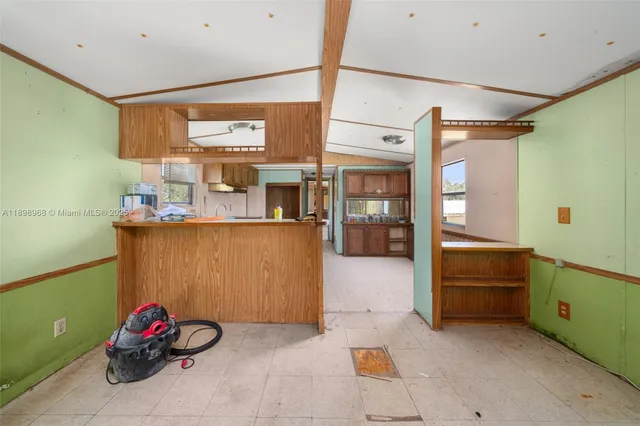 a living room with a couch and a dining table