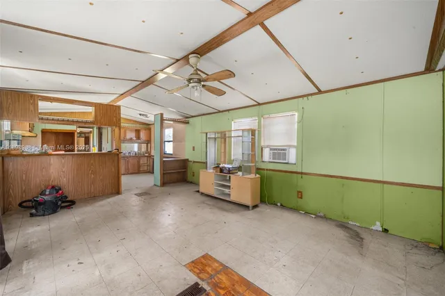 a view of a room with air conditioner duct and windows