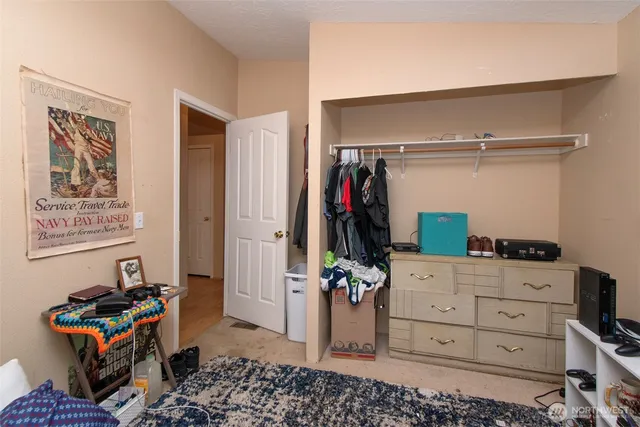 a bed room with a bed and a window