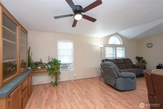 a living room with furniture and a large window