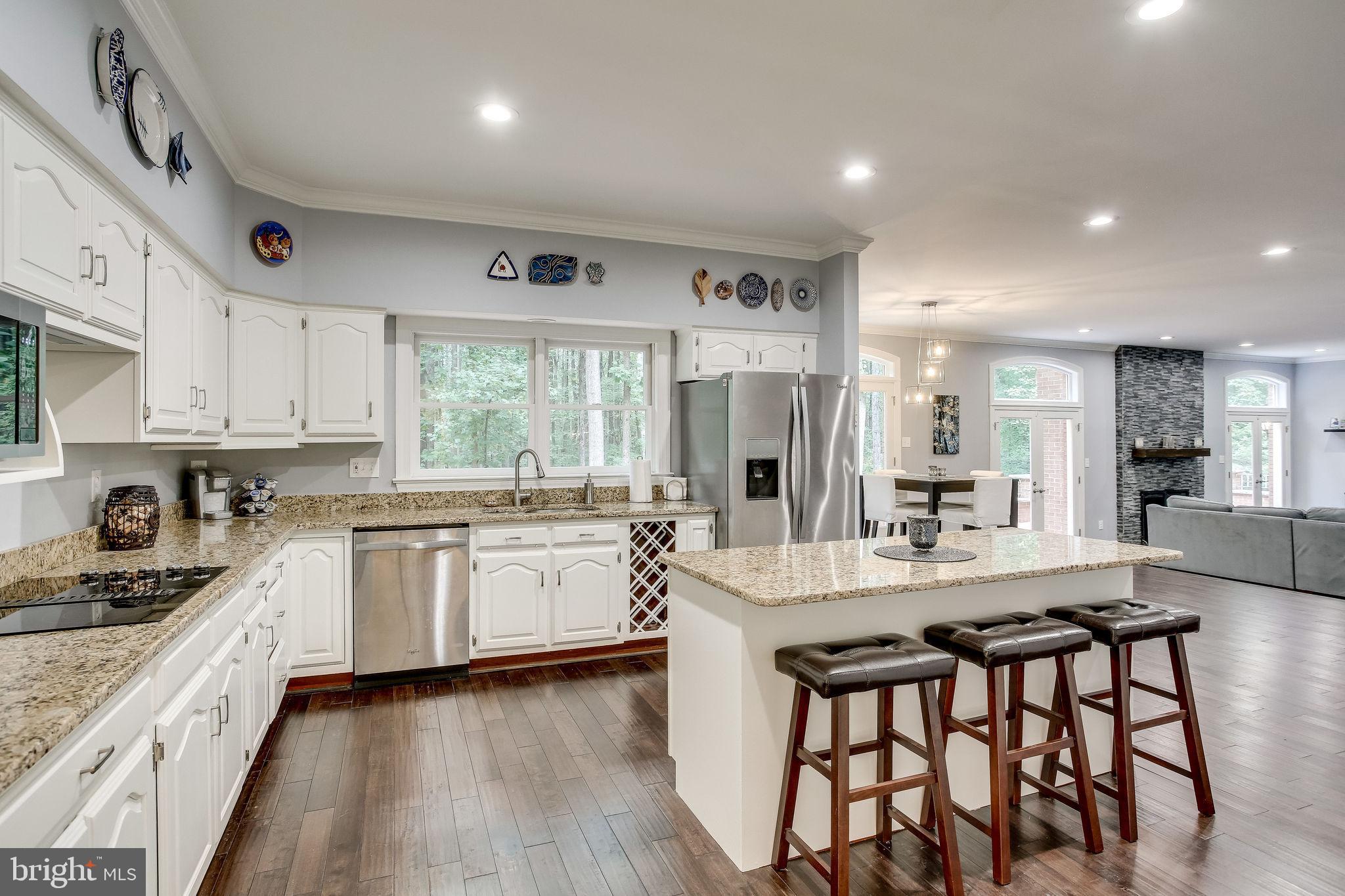 642 Springvale Road Great Falls, VA 22066 - Photo 17 of 44 Kitchen boasts SS appliances, granite & island