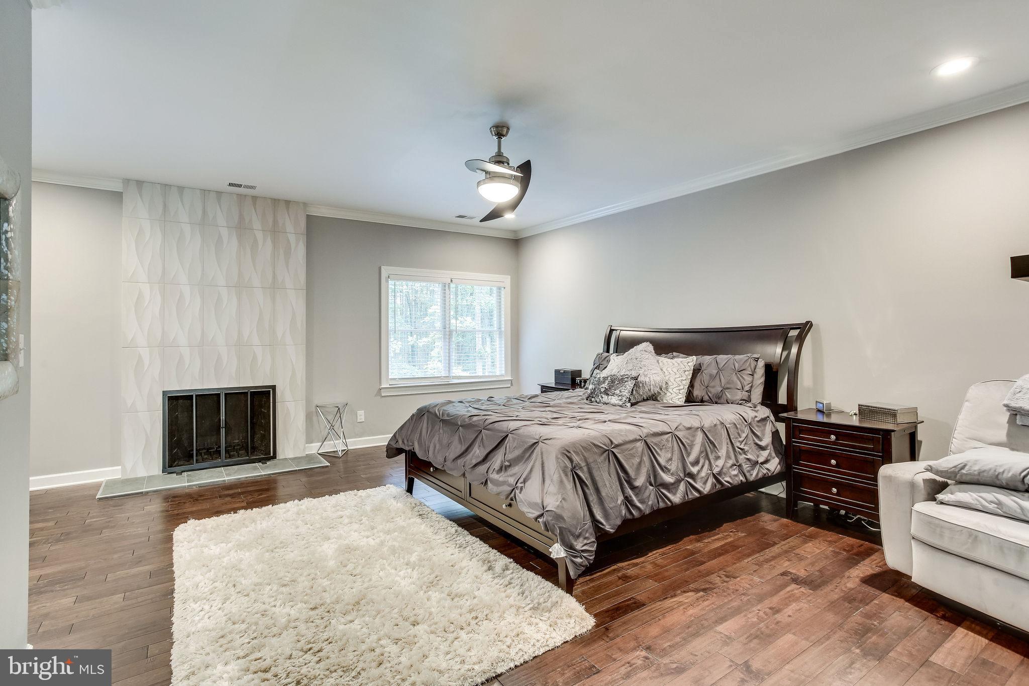 642 Springvale Road Great Falls, VA 22066 - Photo 24 of 44 Owner's Suite with floor-to-ceiling fireplace