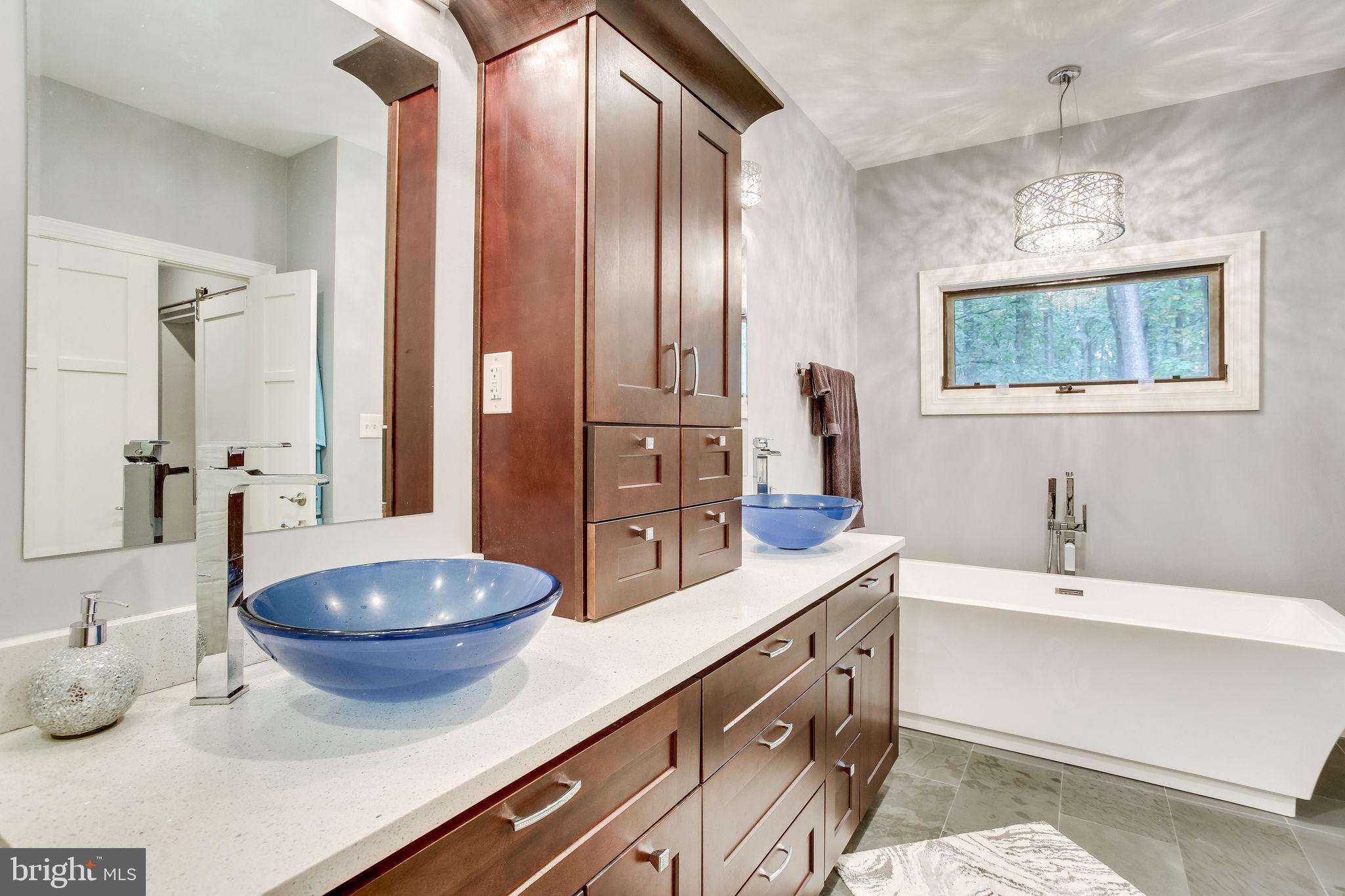 642 Springvale Road Great Falls, VA 22066 - Photo 28 of 44 Luxurious Master Bathroom with glass vessel sinks