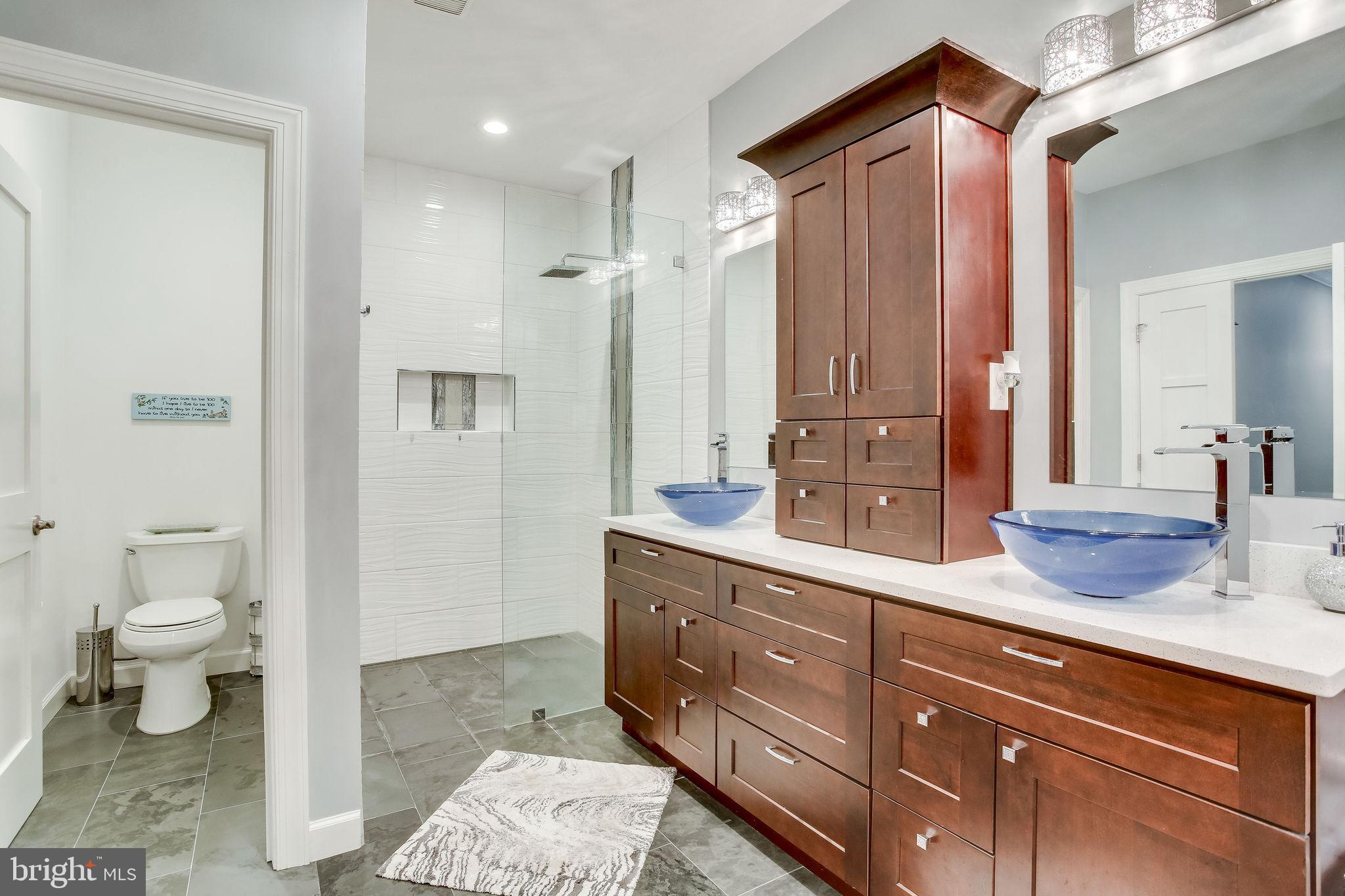 642 Springvale Road Great Falls, VA 22066 - Photo 29 of 44 Frameless walk-in shower w/ custom shower niches