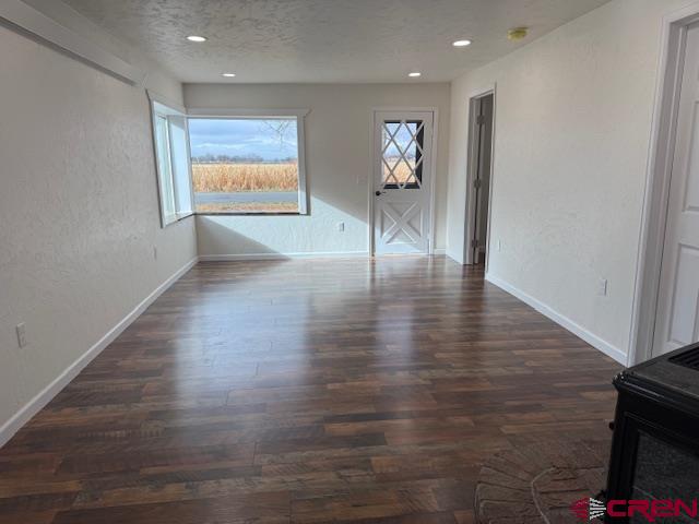 783 1550th Road Delta, CO 81416 - Photo 12 of 23 a view of an empty room with wooden floor and a window
