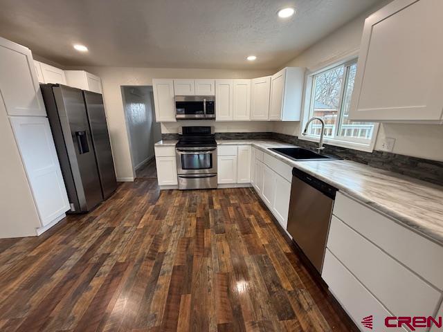783 1550th Road Delta, CO 81416 - Photo 15 of 23 a kitchen with granite countertop a refrigerator sink and microwave