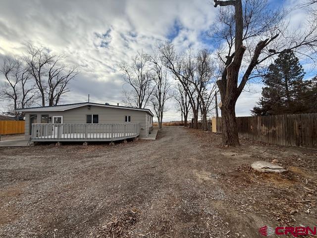 783 1550th Road Delta, CO 81416 - Photo 4 of 23 a front view of house with yard and trees