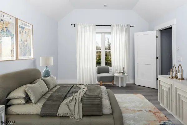 a bedroom with furniture and a window