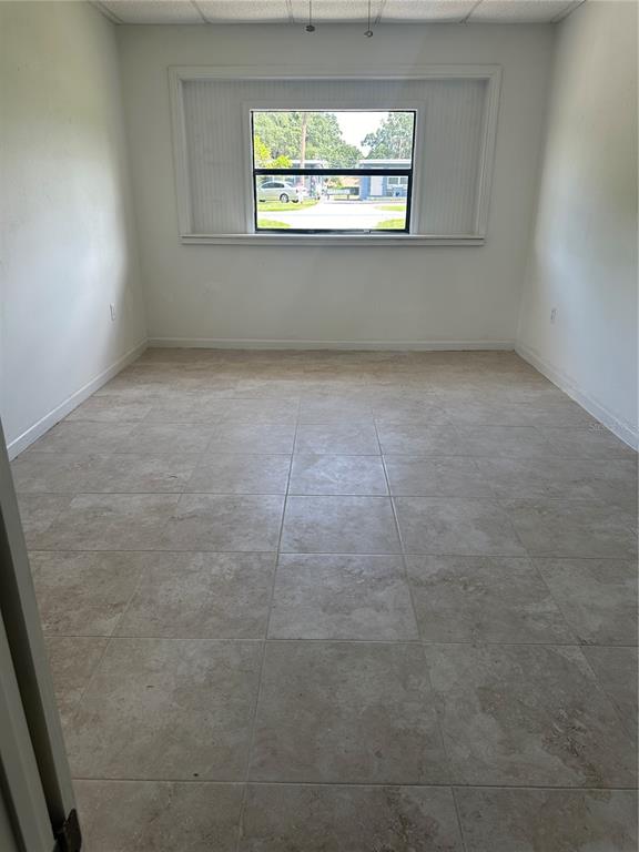 1404 East Alfred Street Tavares, FL 32778 - Photo 13 of 38 an empty room with a window