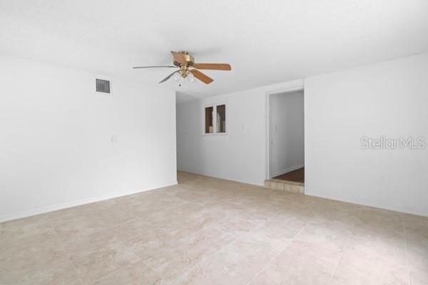 1404 East Alfred Street Tavares, FL 32778 - Photo 17 of 38 a view of room with a ceiling fan