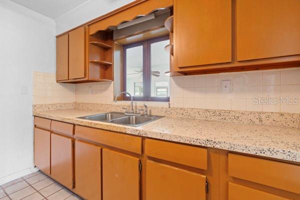 1404 East Alfred Street Tavares, FL 32778 - Photo 22 of 38 a bathroom with a sink and a mirror